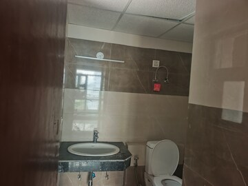 Bathroom in 1 BHK Apartment at Cosmos Express 99, Sector 99 – for Sale