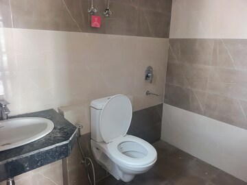 Bathroom in 1 BHK Apartment at Cosmos Express 99, Sector 99 – for Sale