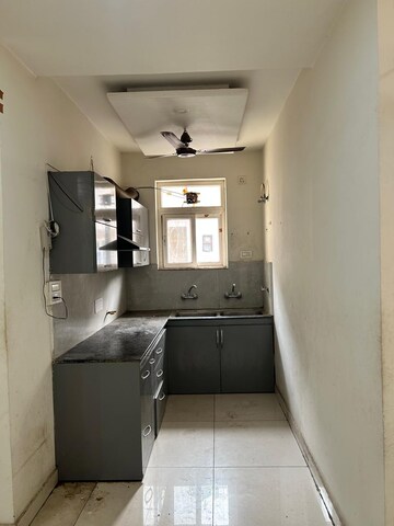 Kitchen in 3 BHK Builder Floor at Dhakoli Village – for Sale