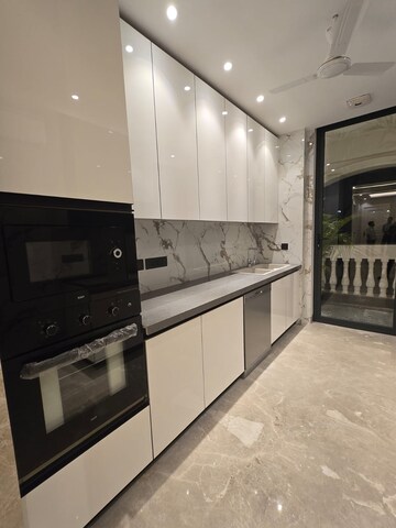 Kitchen in 4 BHK Builder Floor at Ansal API Esencia, Sector 67 – for Sale