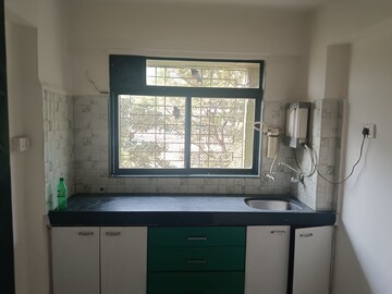 Kitchen in 1 BHK Apartment at RNA NG Regency Phase I, Balkum Pada – for Sale