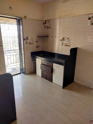 Kitchen in 2 BHK Apartment at Aries CHS, Vasai East – for Sale