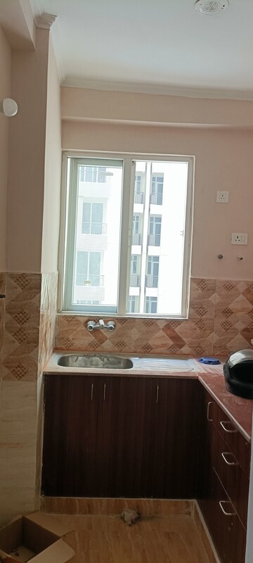 Kitchen in 2 BHK Apartment at Amrapali Golf Homes, Sector 4, Greater Noida – for Sale