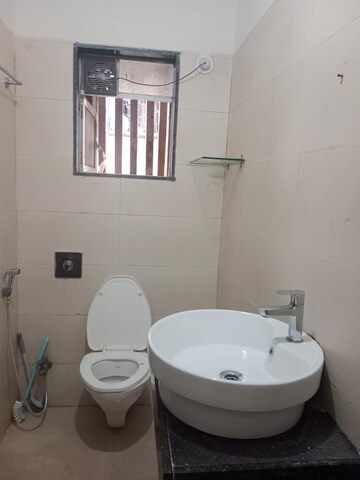 Bathroom in 2 BHK Apartment at Raunak Paradise, Kokanipada – for Sale