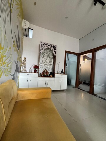 Living Room in Studio Apartment at Gaur City 2  – for Sale