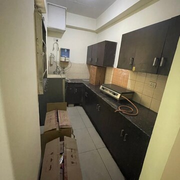 Kitchen in 2 BHK Apartment at Ajnara Grace, Sehani Khurd – for Sale
