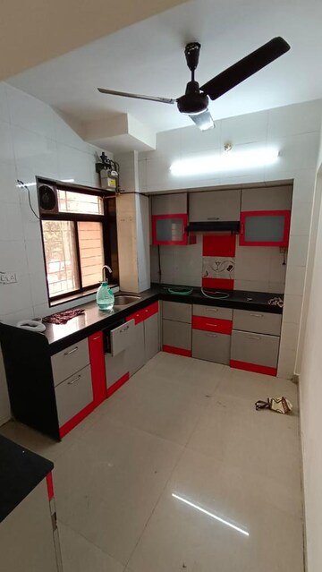 Kitchen in 2 BHK Apartment at Raunak Unnathi Woods Phase 4 And 5, Ghodbunder Road – for Sale