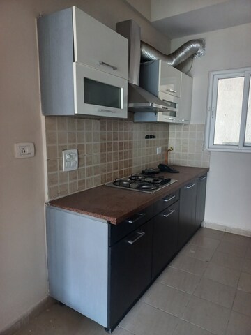 Kitchen in 3 BHK Apartment at Mahagun Moderne, Sector 78 – for Sale