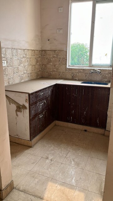 Kitchen in 3 BHK Apartment at Amrapali Golf Homes, Sector 4, Greater Noida – for Sale
