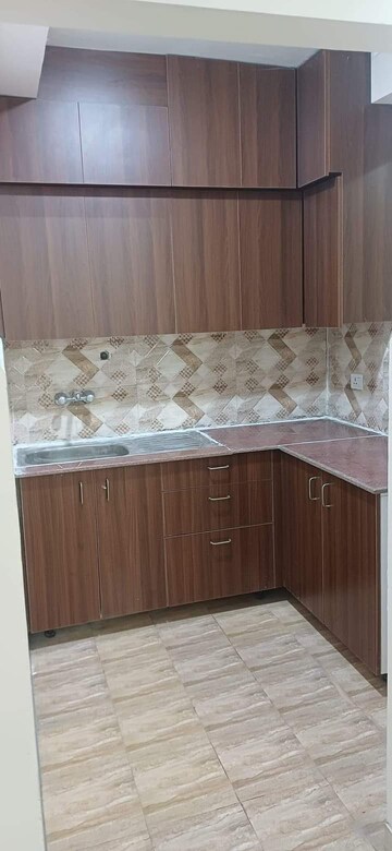 Kitchen in 2 BHK Apartment at Amrapali Golf Homes, Sector 4, Greater Noida – for Sale