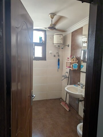 Bathroom in 3 BHK Apartment at Dhakoli Village – for Sale