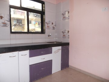 Kitchen in 1 BHK Apartment at Reliable Garden, Naigaon East – for Sale