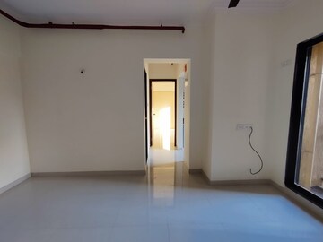 Living Room in 1 BHK Apartment at Raunak Unnathi Woods Phase 7 A And B, Ghodbunder Road – for Sale