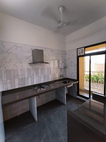 Kitchen in 1 BHK Apartment at Khandeshwar – for Sale