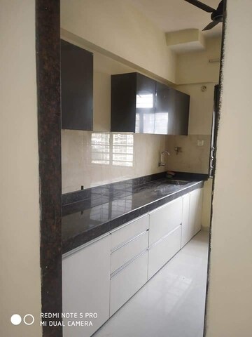 Kitchen in 3 BHK Apartment at Satguru Solitaire, Kasarvadavali – for Sale