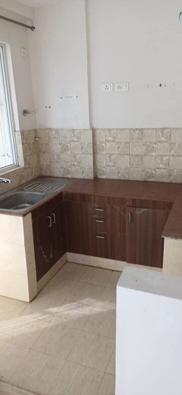Kitchen in 2 BHK Apartment at Amrapali Golf Homes, Sector 4, Greater Noida – for Sale