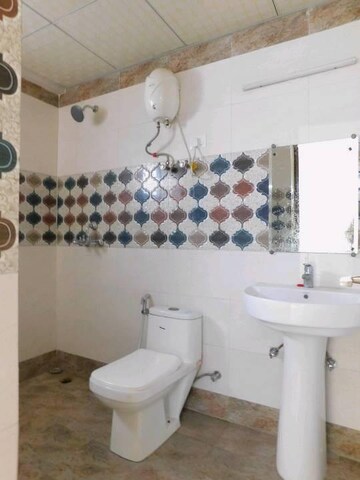 Bathroom in 4 BHK Apartment at Saya Gold Avenue, Vaibhav Khand – for Sale