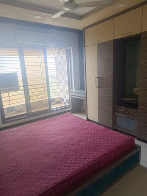 Bedroom in 2 BHK Apartment at The Wadhwa Palm Beach Residency, Nerul – for Rent