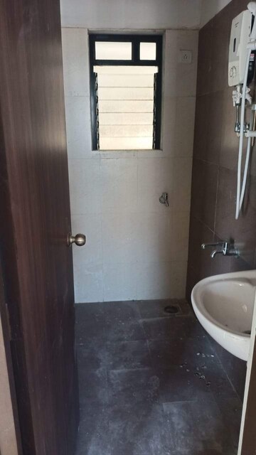 Bathroom in 1 BHK Apartment at Raunak City 3, Kalyan West – for Sale