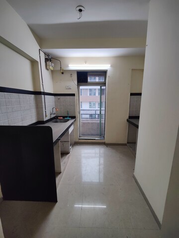 Kitchen in 1 BHK Apartment at Mahavir Kalpavruksha, Ghodbunder Road – for Sale