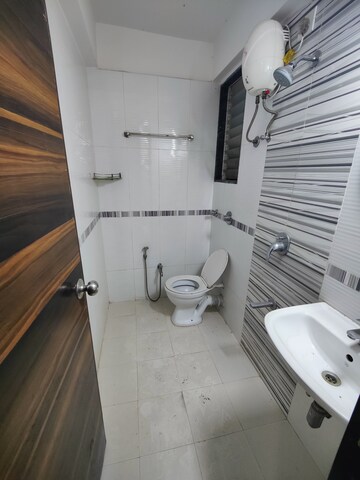 Bathroom in 1 BHK Apartment at Mahavir Kalpavruksha, Ghodbunder Road – for Sale