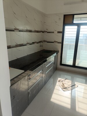 Kitchen in 1 BHK Apartment at Dynamic Crest, Shilphata – for Sale