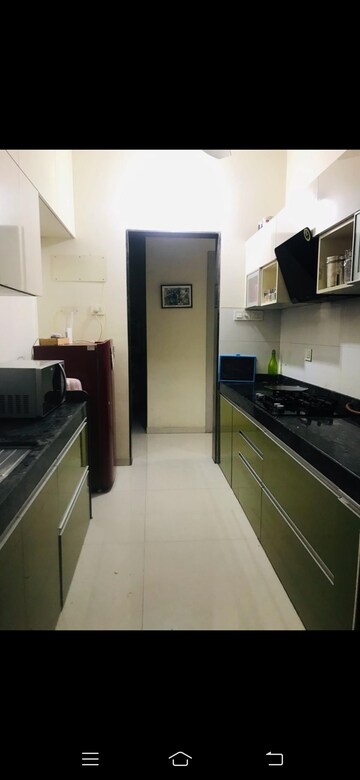 Kitchen in 2 BHK Apartment at Rustomjee Urbania, Majiwada – for Rent