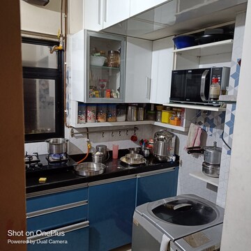 Kitchen in 1 BHK Apartment at Unnathi Woods Phase 1 And 2, Ghodbunder Road – for Sale