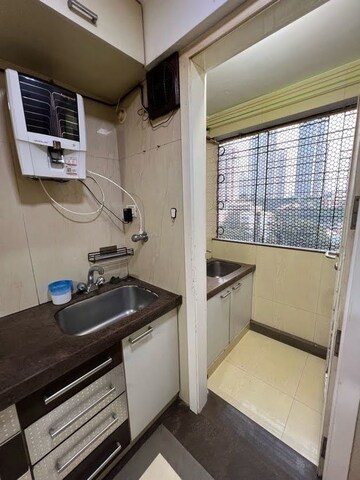 Kitchen in 2 BHK Apartment at Shagun CHS, Malad East – for Rent