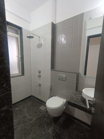 Bathroom in 2 BHK Apartment at Zaveri Ashtavinayak CHS, Andheri West – for Sale