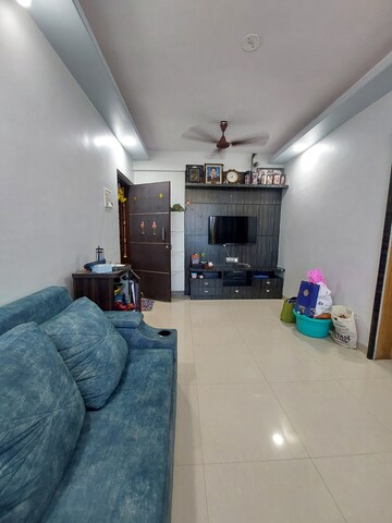 Living Room in 1 BHK Apartment at Kanakia Apartments, Mira Road – for Rent
