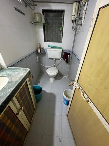 Bathroom in 2 BHK Apartment at RNA Courtyard, Mira Road – for Rent