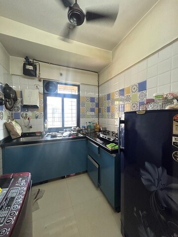 Kitchen in 1 BHK Apartment at Raunak Heights, Ghodbunder Road – for Sale