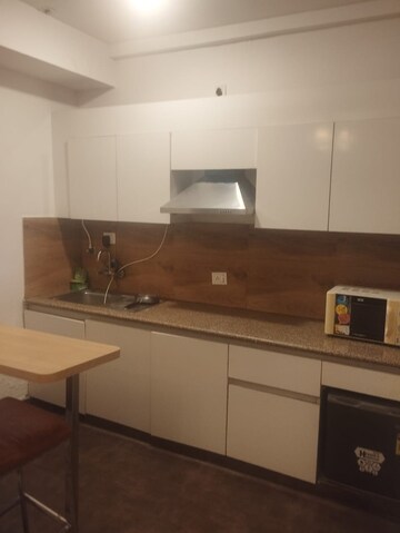 Kitchen in Studio Apartment at Nimbus The Golden Palm, Sector 168 – for Sale