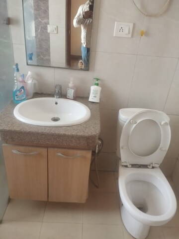 Bathroom in Studio Apartment at Nimbus The Golden Palm, Sector 168 – for Sale
