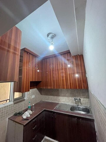 Kitchen in 2 BHK Apartment at Amrapali Golf Homes, Sector 4, Greater Noida – for Sale