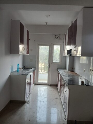 Kitchen in 2.5 BHK Apartment at Homes 121, Sector 121 – for Rent