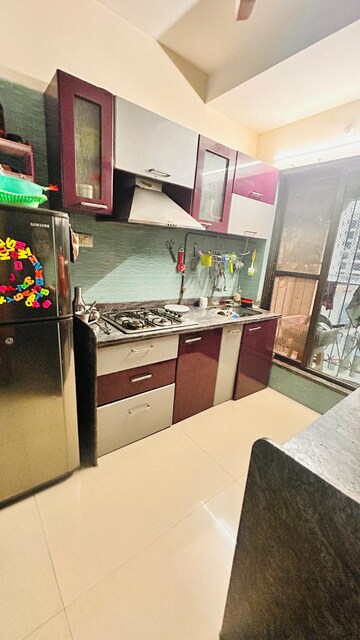 Kitchen in 2 BHK Apartment at Tharwani Rosewood Heights, Kharghar Sector 10 – for Rent