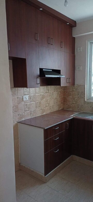 Kitchen in 2 BHK Apartment at Amrapali Golf Homes, Sector 4, Greater Noida – for Sale