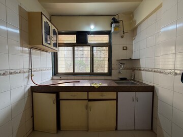 Kitchen in 1 BHK Apartment at Raj Utsav Apartment, Dahisar East – for Sale