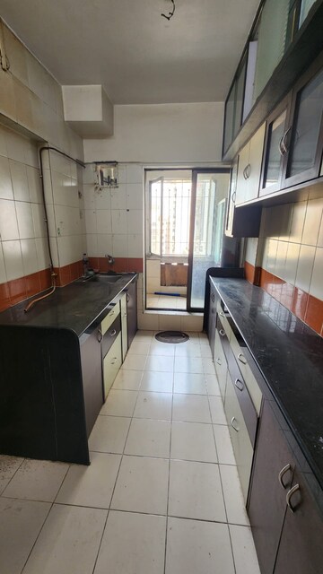 Kitchen in 1 BHK Apartment at Omkar Signet, Malad East – for Rent