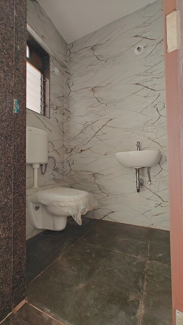Bathroom in 1 BHK Apartment at MS Shila Bina CHS, Borivali West – for Sale