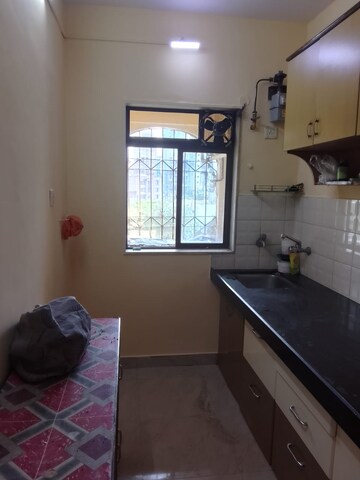 Kitchen in 1.5 BHK Apartment at National Avenue, Kandivali East – for Rent