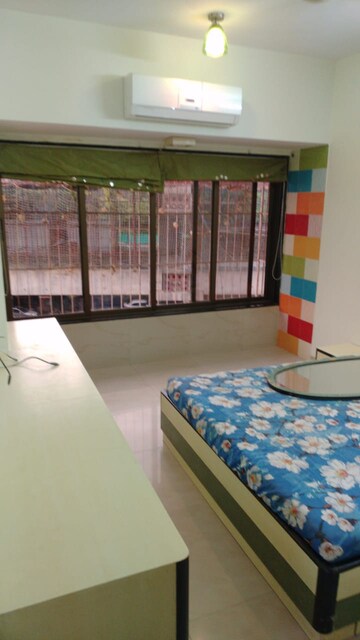 Bedroom in 2 BHK Apartment at Indradarshan II, Oshiwara – for Rent