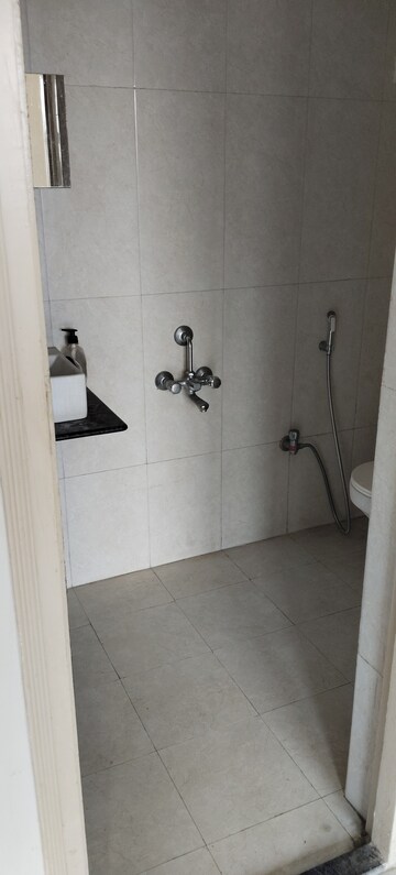 Bathroom in 1 BHK Apartment at Bharat Ecovistas, Shilphata – for Rent
