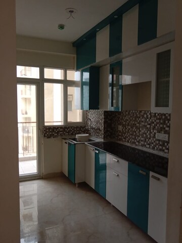 Kitchen in 2 BHK Apartment at Rajhans Residency, Sector 1 Greater Noida – for Sale