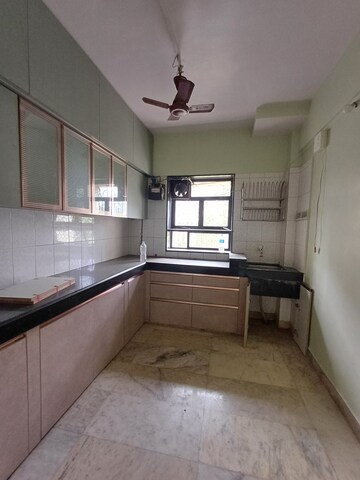 Kitchen in 2 BHK Apartment at Anand Sagar Residency CHS, Khopat – for Rent