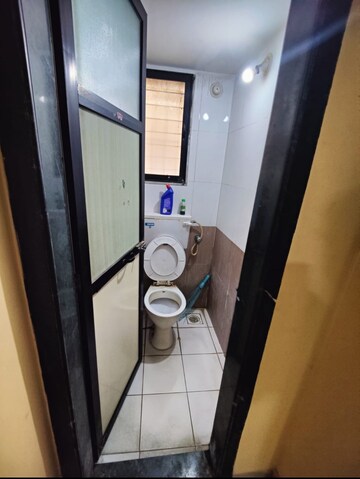 Bathroom in 1 BHK Apartment at Raunak Unnathi Woods Phase 4 And 5, Ghodbunder Road – for Sale