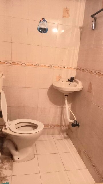 Bathroom in 1 BHK Apartment at Gokul Garden CHS, Kandivali East – for Rent