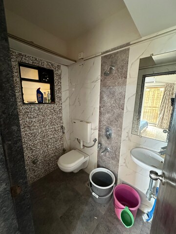 Bathroom in 1 BHK Apartment at Triveni Dynamic Ultima Bliss, Kalyan West – for Rent